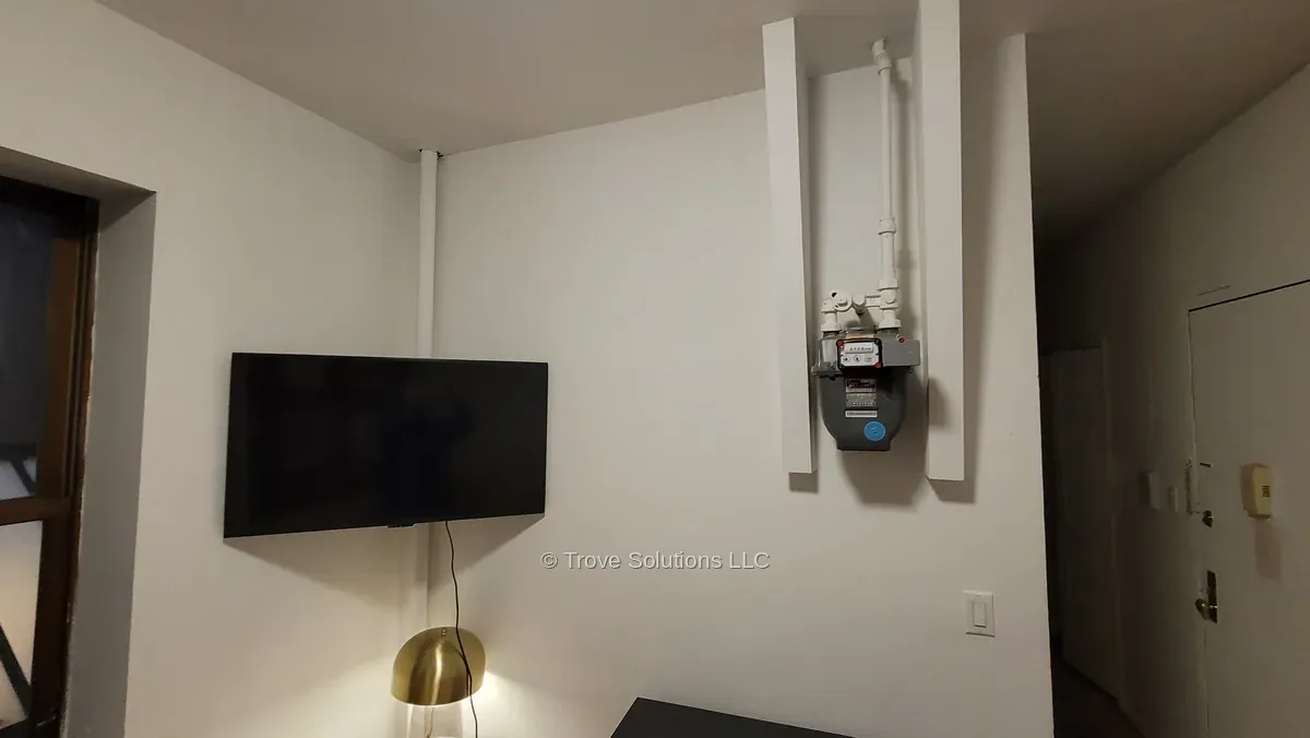 Corner TV mount installation, Manhattan apartment Corner TV installation Manhattan apartment with gas meter nearby