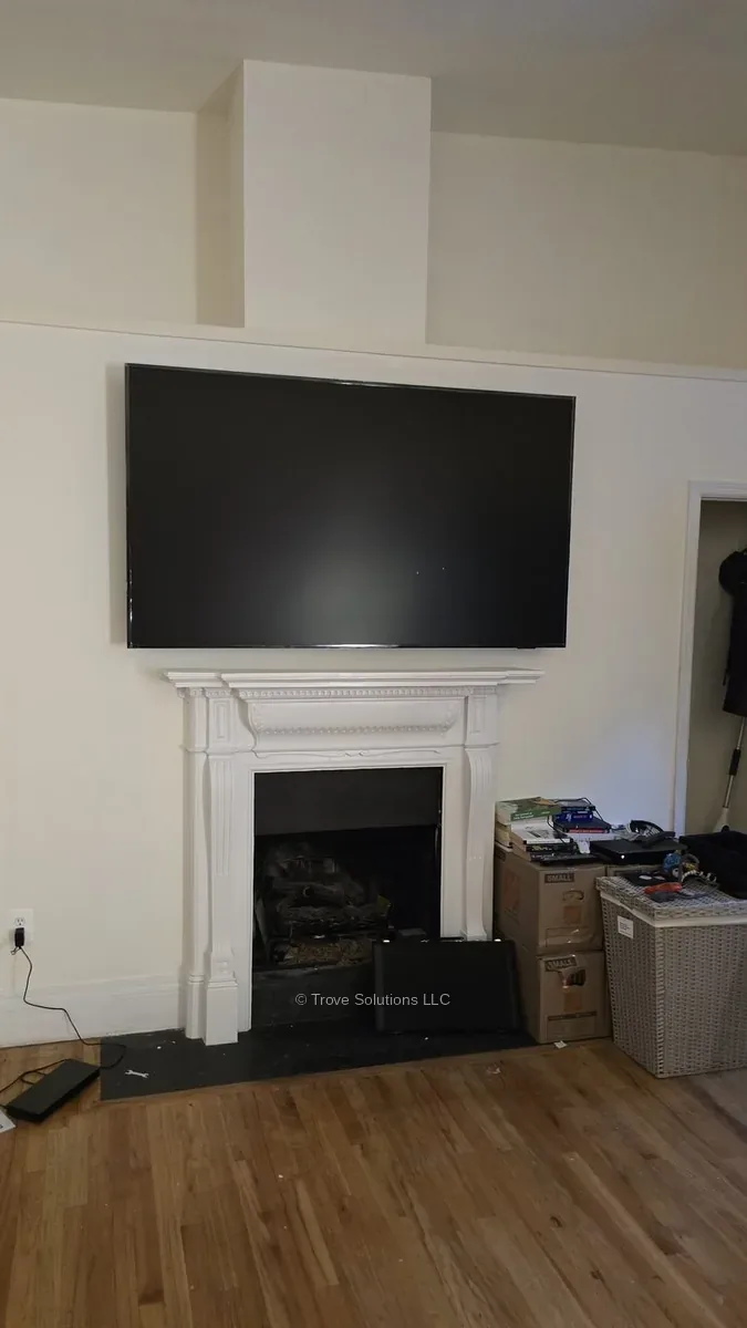 TV installation above fireplace, Manhattan TV mounted above fireplace Manhattan apartment