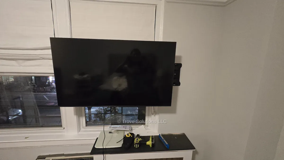 Full motion TV mount extended over window, Manhattan Full motion TV mount pulled out over window Manhattan